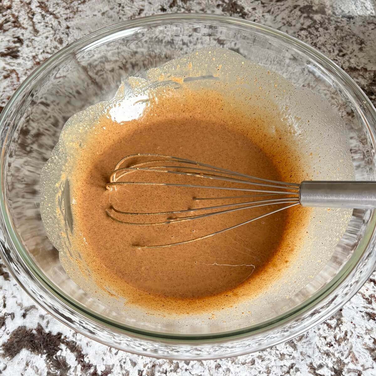 Gingerbread batter for fudge in a glass mixing bowl.