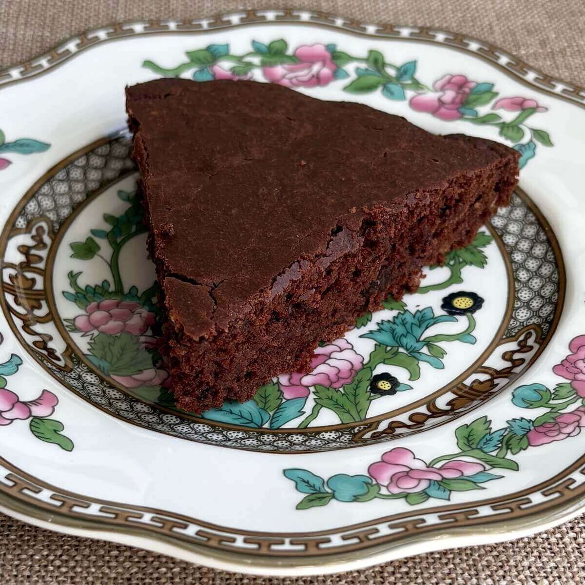 A slice of oat flour cake on a plate.