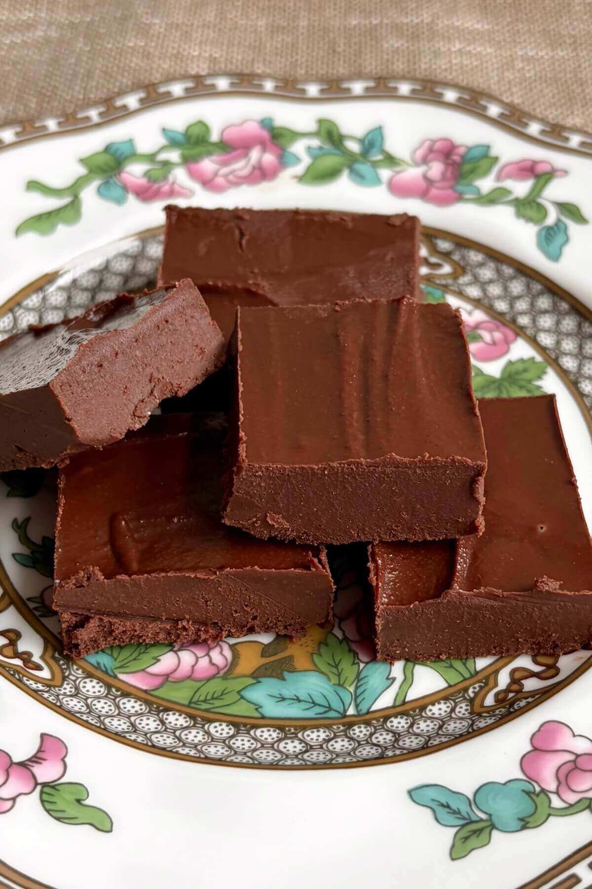 Squares of fudge on a vintage plate.