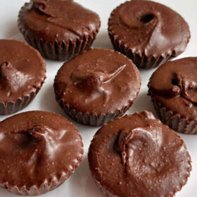 Hazelnut butter cups on a white plate.