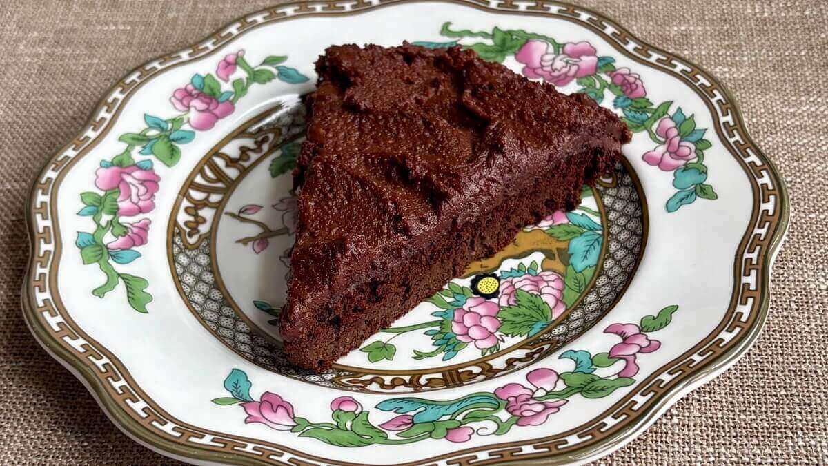 A slice of monk fruit cake on a plate.