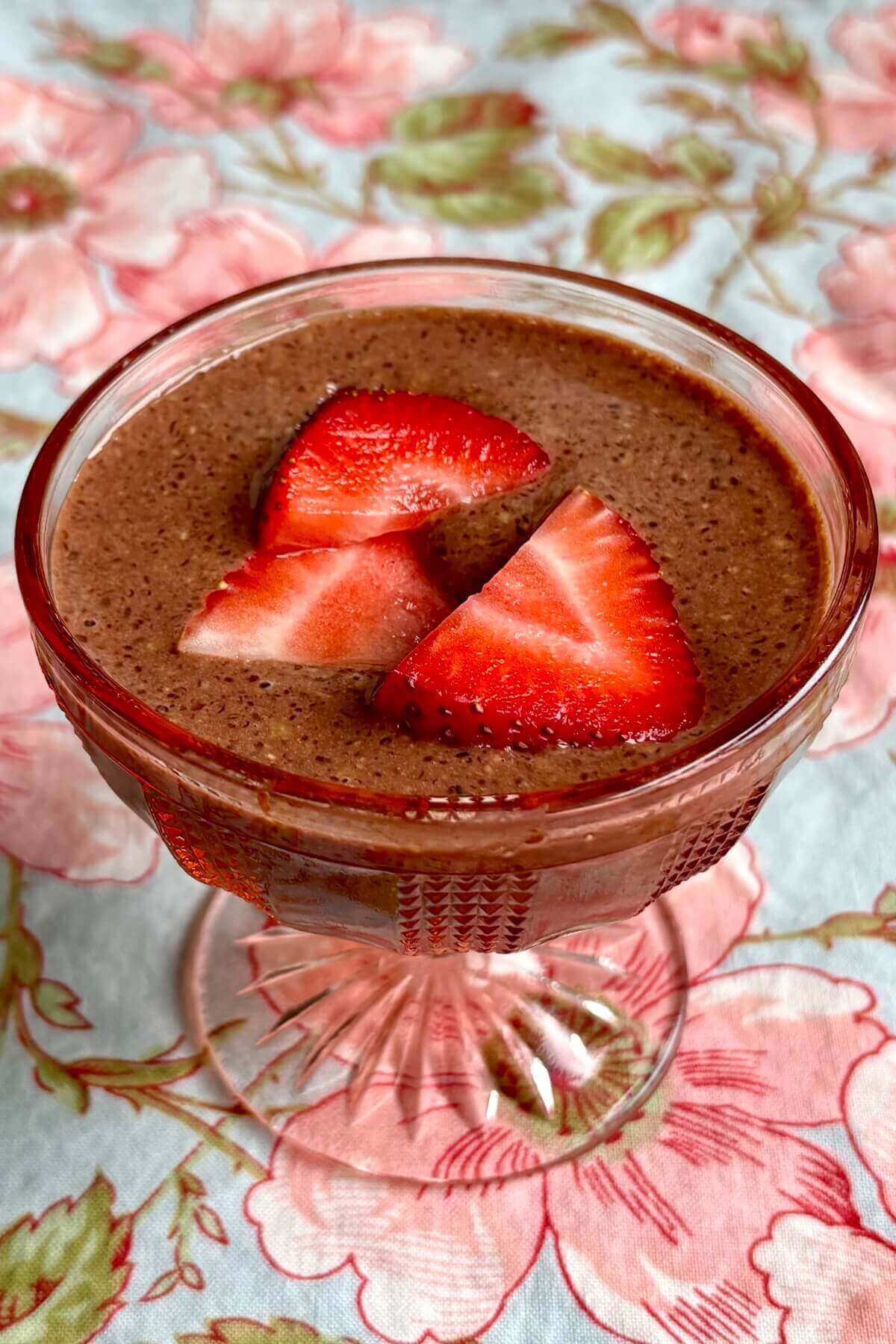 Chocolate flax pudding in a vintage glass dish.
