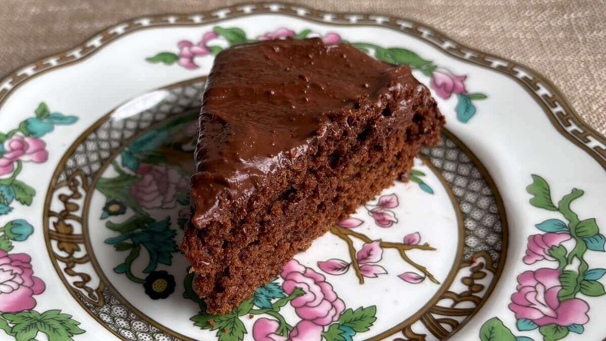 A slice of flaxseed chocolate cake on a plate.