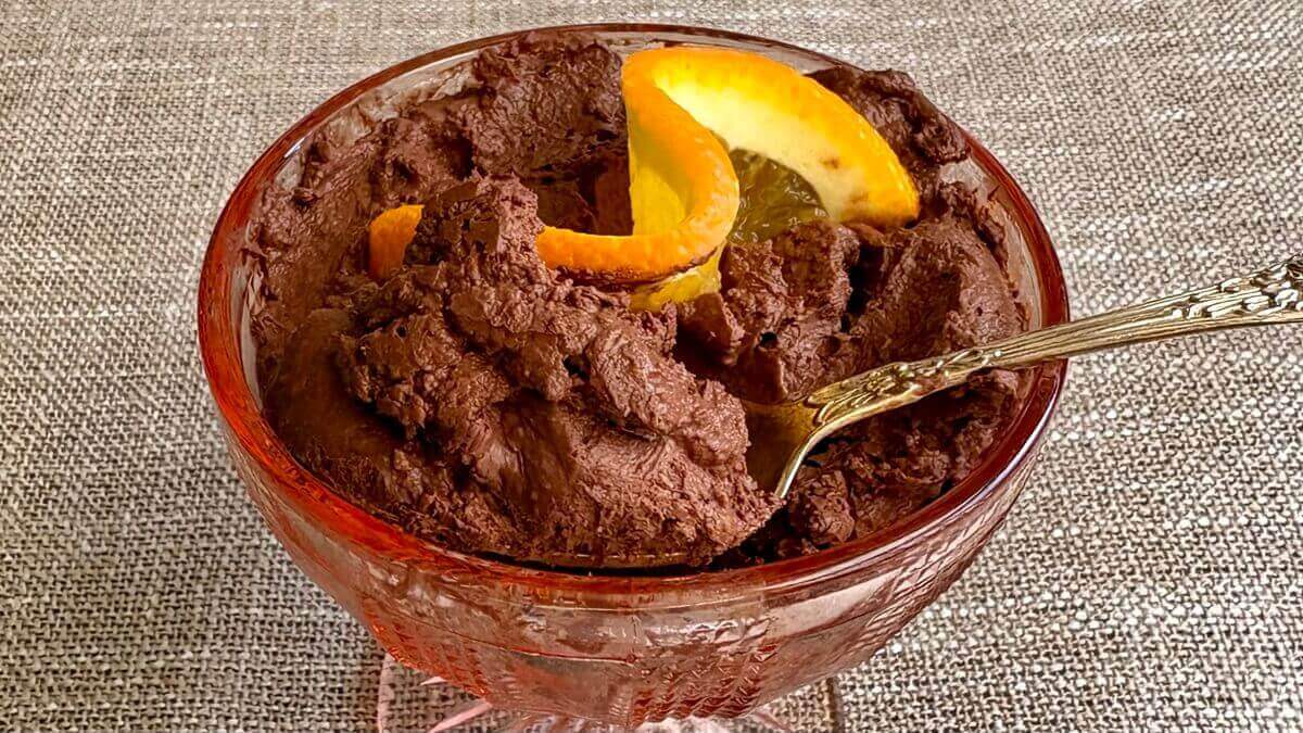 Orange dark chocolate mousse in a vintage glass dish.