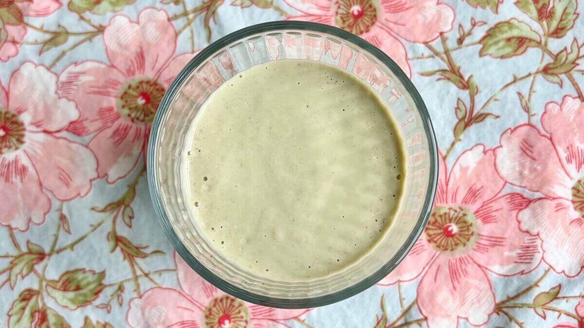 An avocado oatmeal shake in a glass.