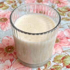 A banana smoothie (no yogurt) in a glass.