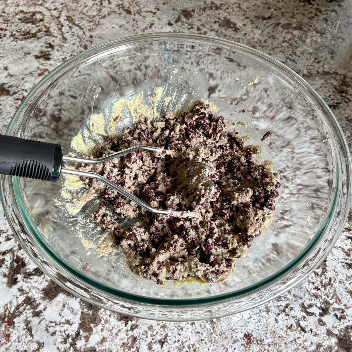 Black bean enchilada filling in a glass bowl.