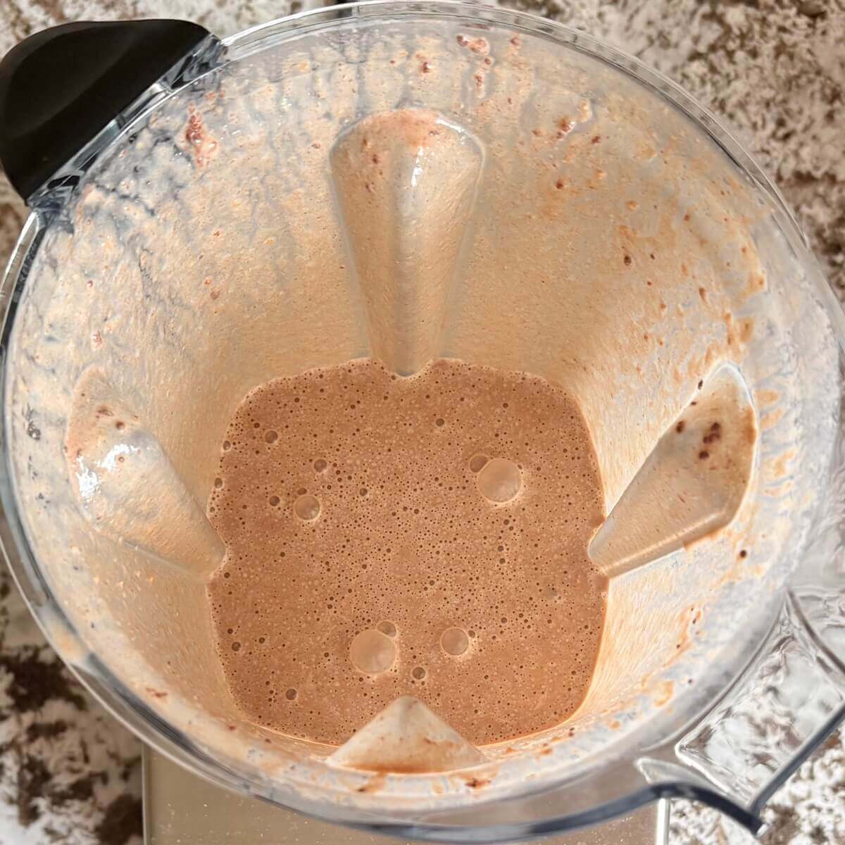 A peanut butter cup flavored smoothie in a blender.