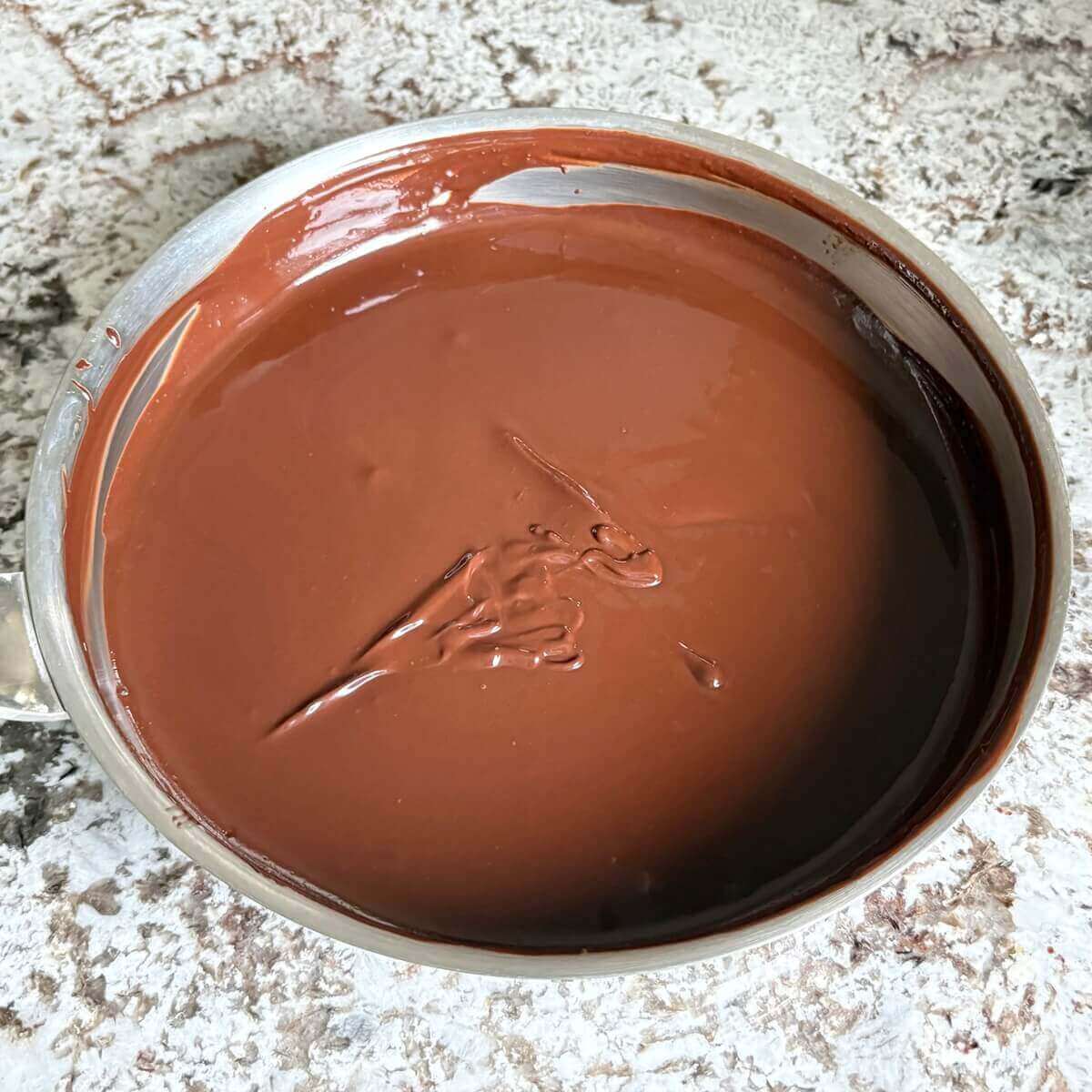 Fudge batter in a steel pan.