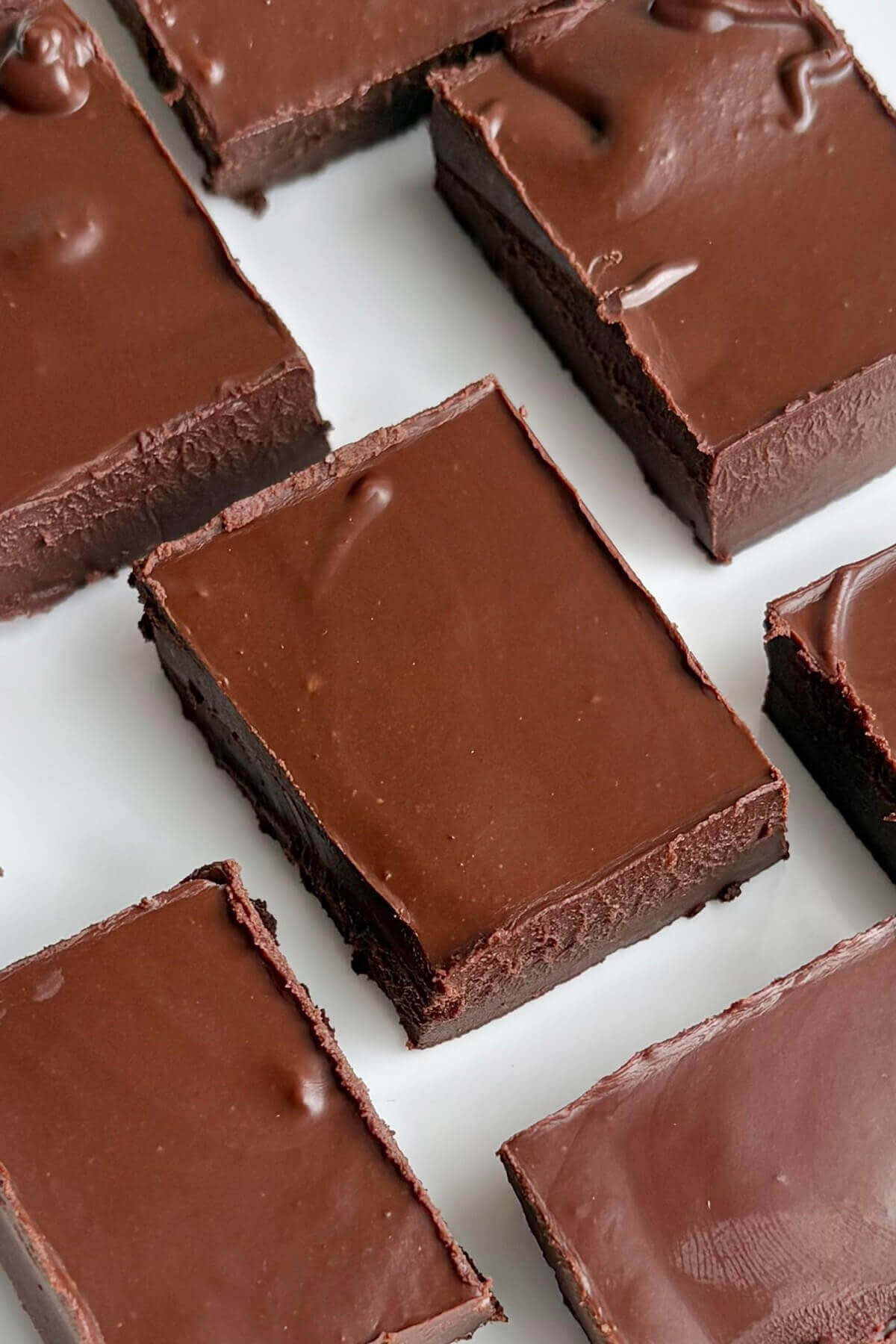 Cashew butter chocolate fudge on a white plate.