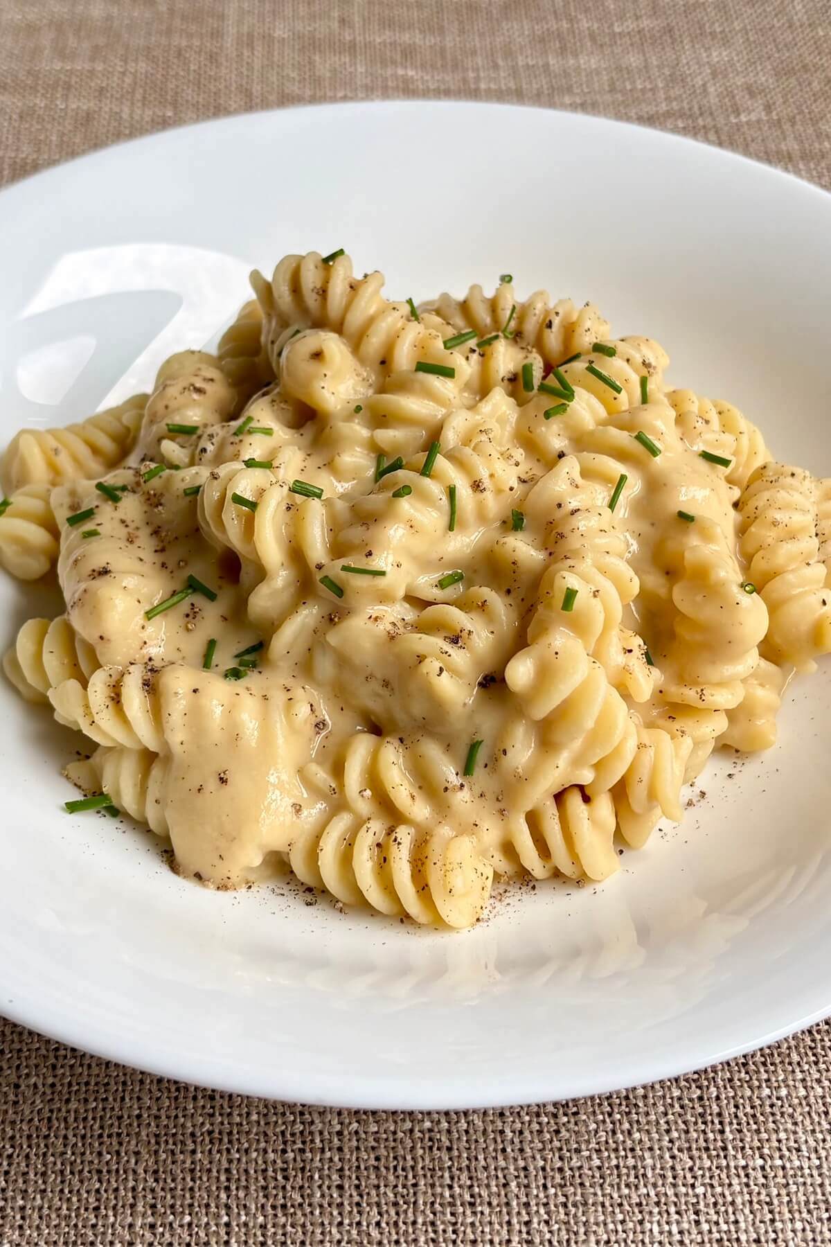 Pasta with a cream sauce made from chickpeas in a bowl.