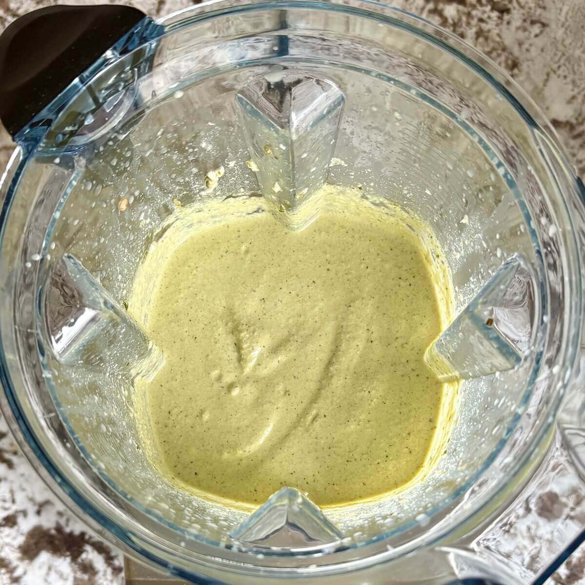 Creamy vegan poblano sauce in a blender.