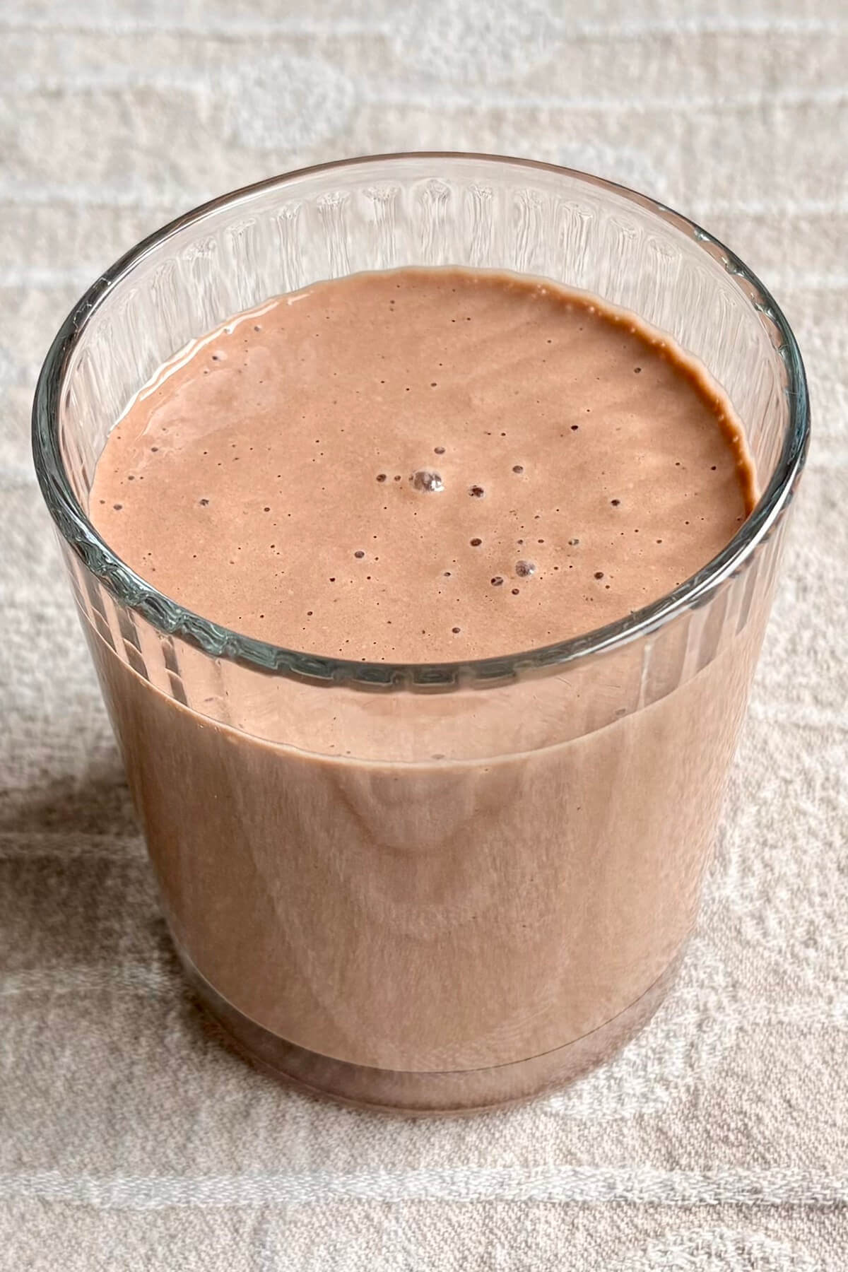 A macadamia nut smoothie in a glass.