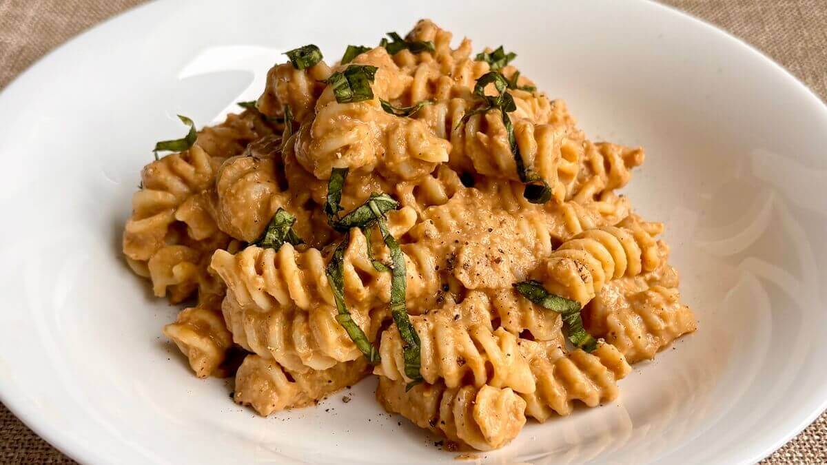 Noodles smothered in pasta sauce made with lentils.