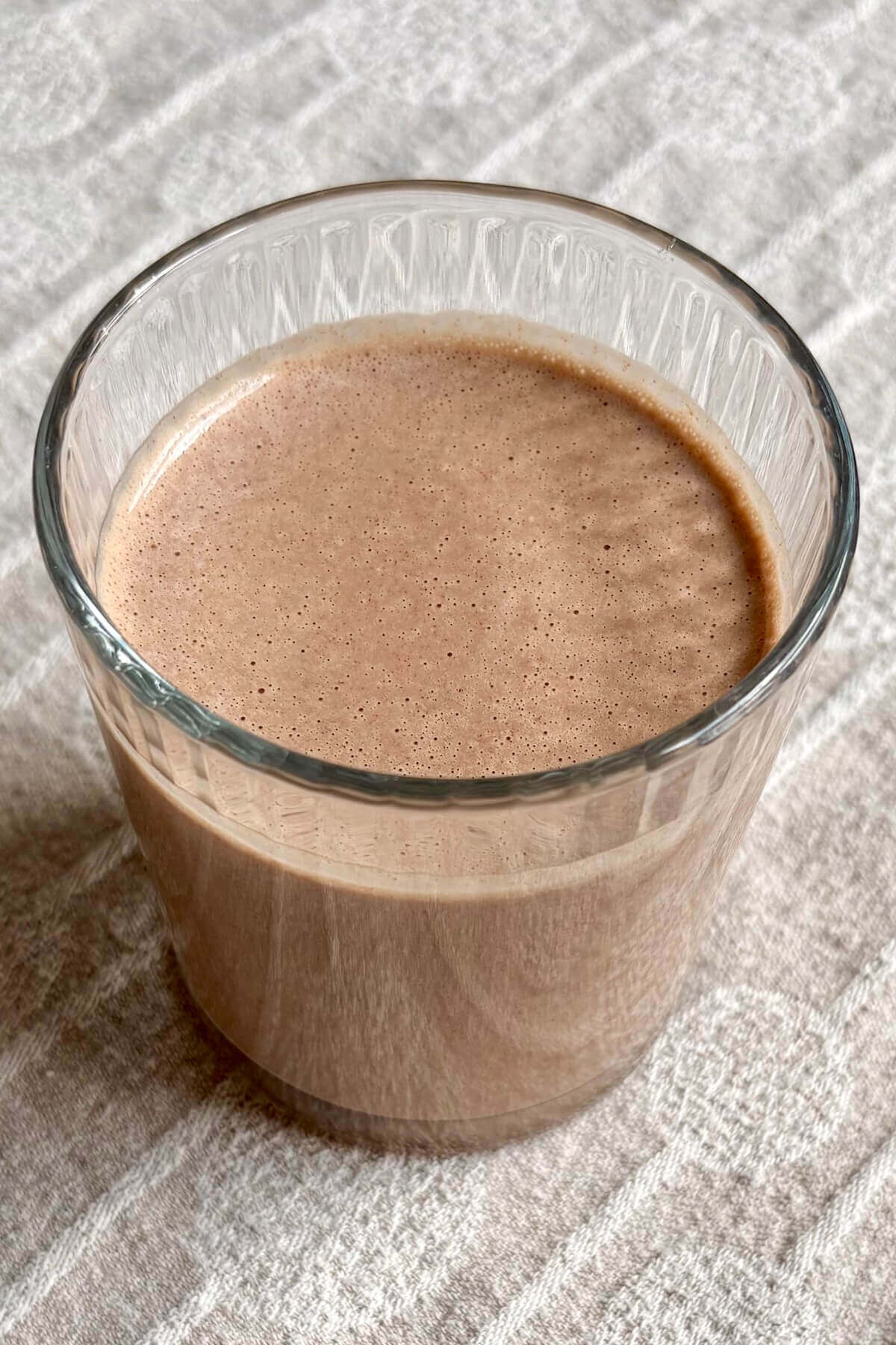 A peanut butter cup shake in a glass.