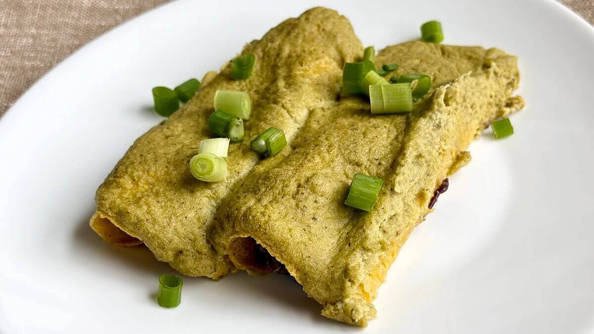 Poblano enchiladas on a white plate.