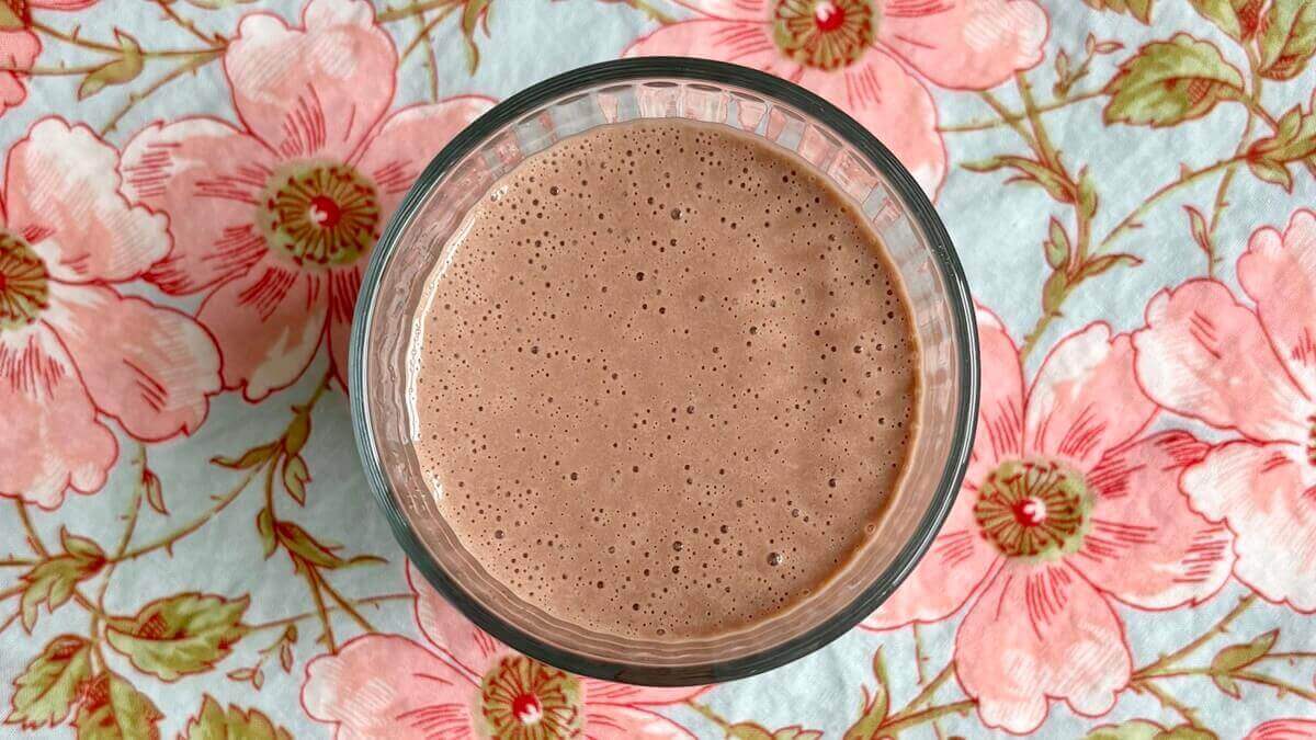 A smoothie made with cashew butter in a glass.