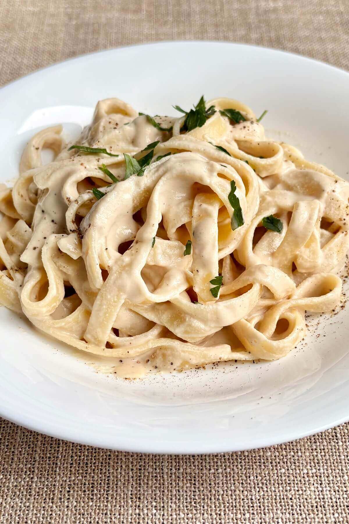Fettucine noodles smothered in a vegan Alfredo sauce.