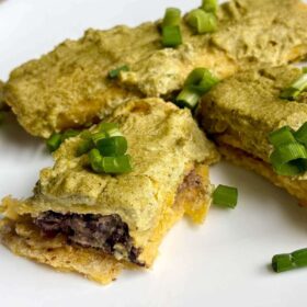 Vegan black bean enchiladas on a plate.