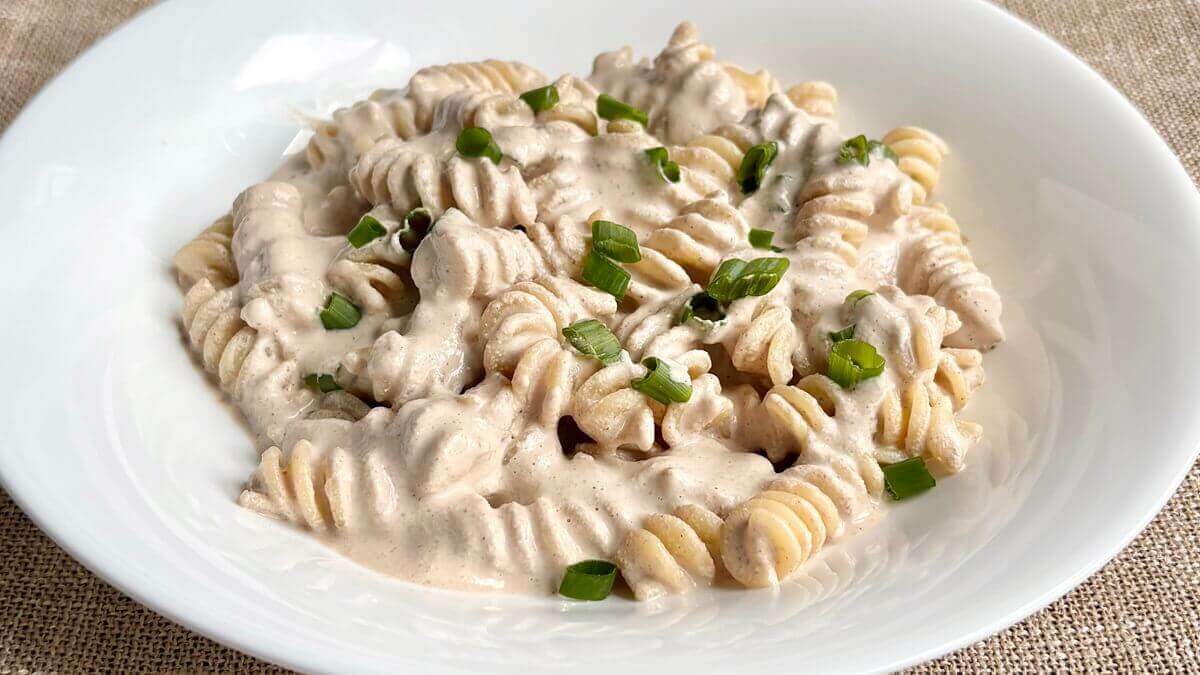 Noodles smothered in a vegan walnut pasta sauce.