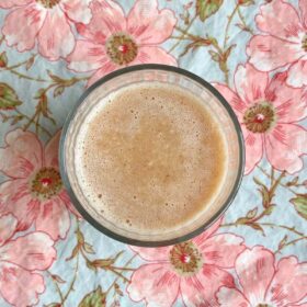A whole lemon smoothie in a glass.