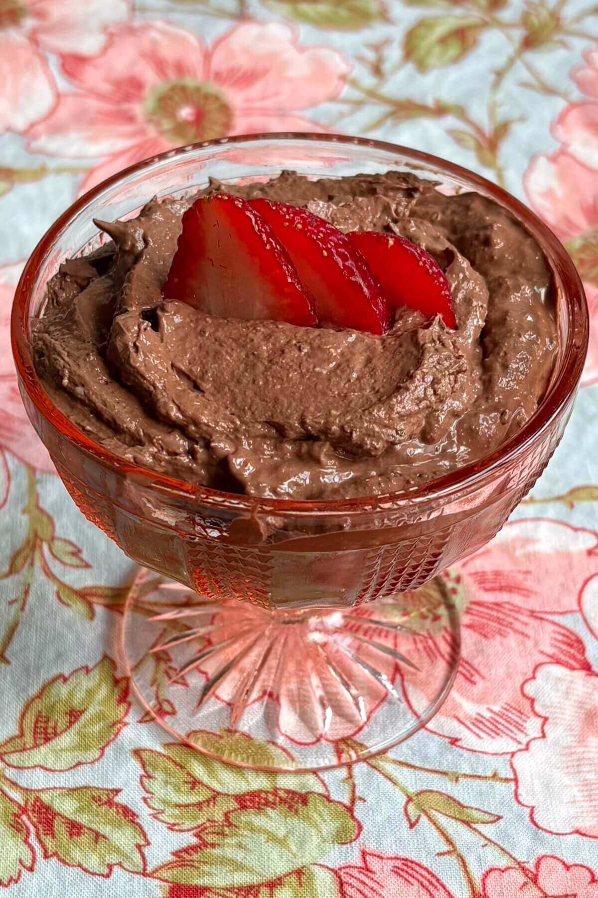 Chia seed chocolate mousse in a vintage glass dish.