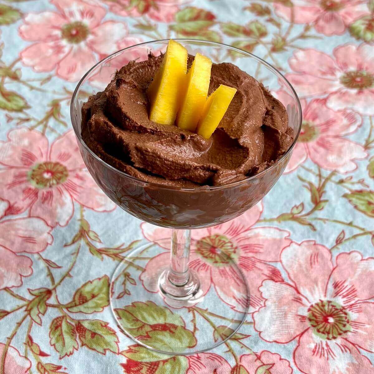 Mango chocolate mousse in a vintage glass dish.