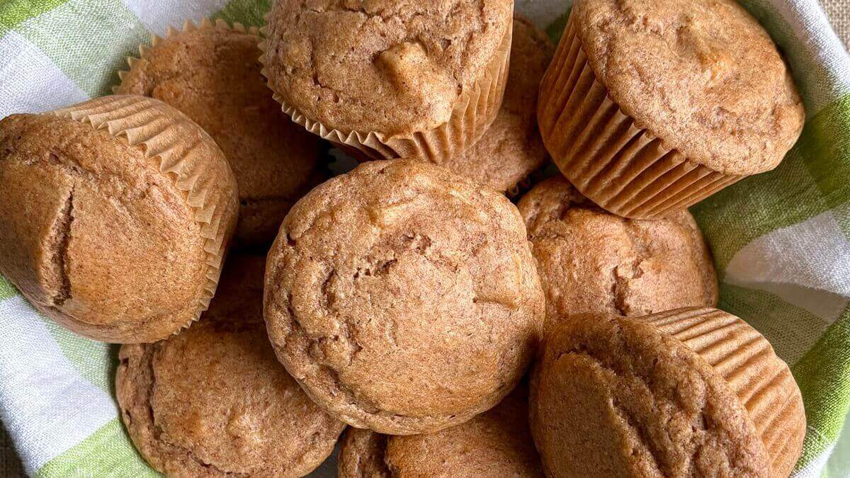 Muffins in a cloth-lined basket.