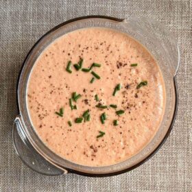 Raw vegan soup in a glass bowl.