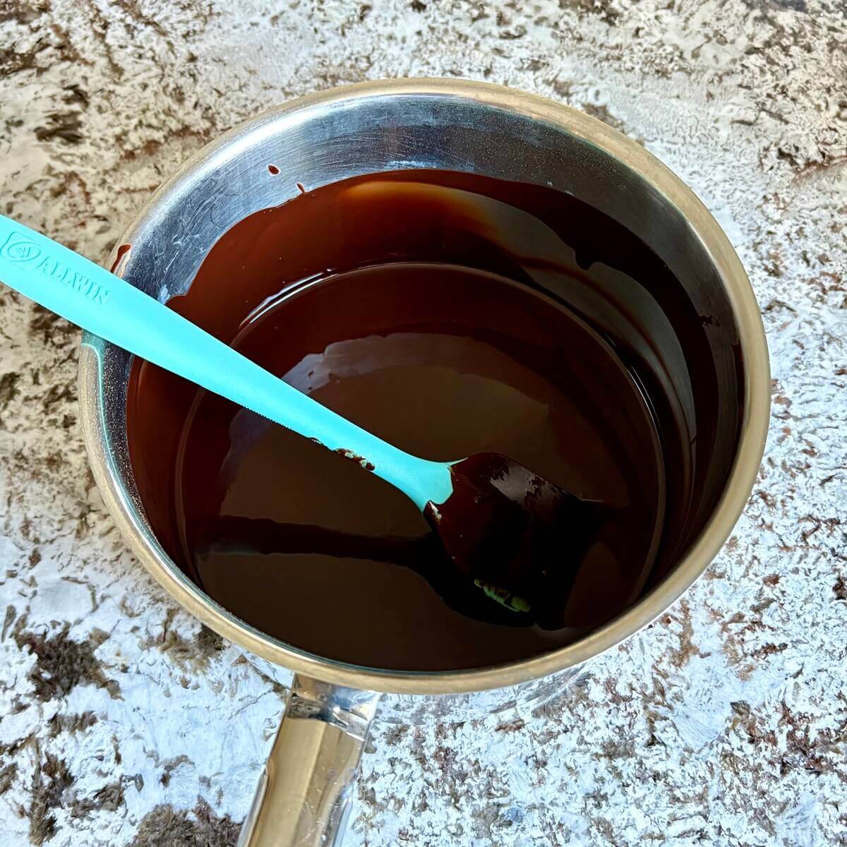 A keto chocolate mixture in a steel pot.