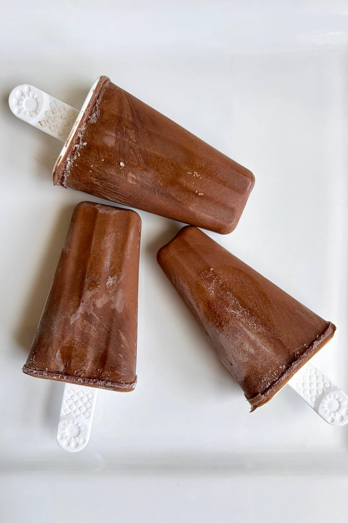 Keto popsicles on a plate.