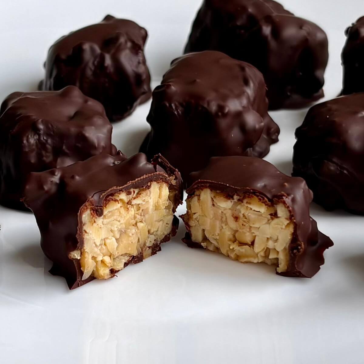 Tempeh dessert bites on a white plate.