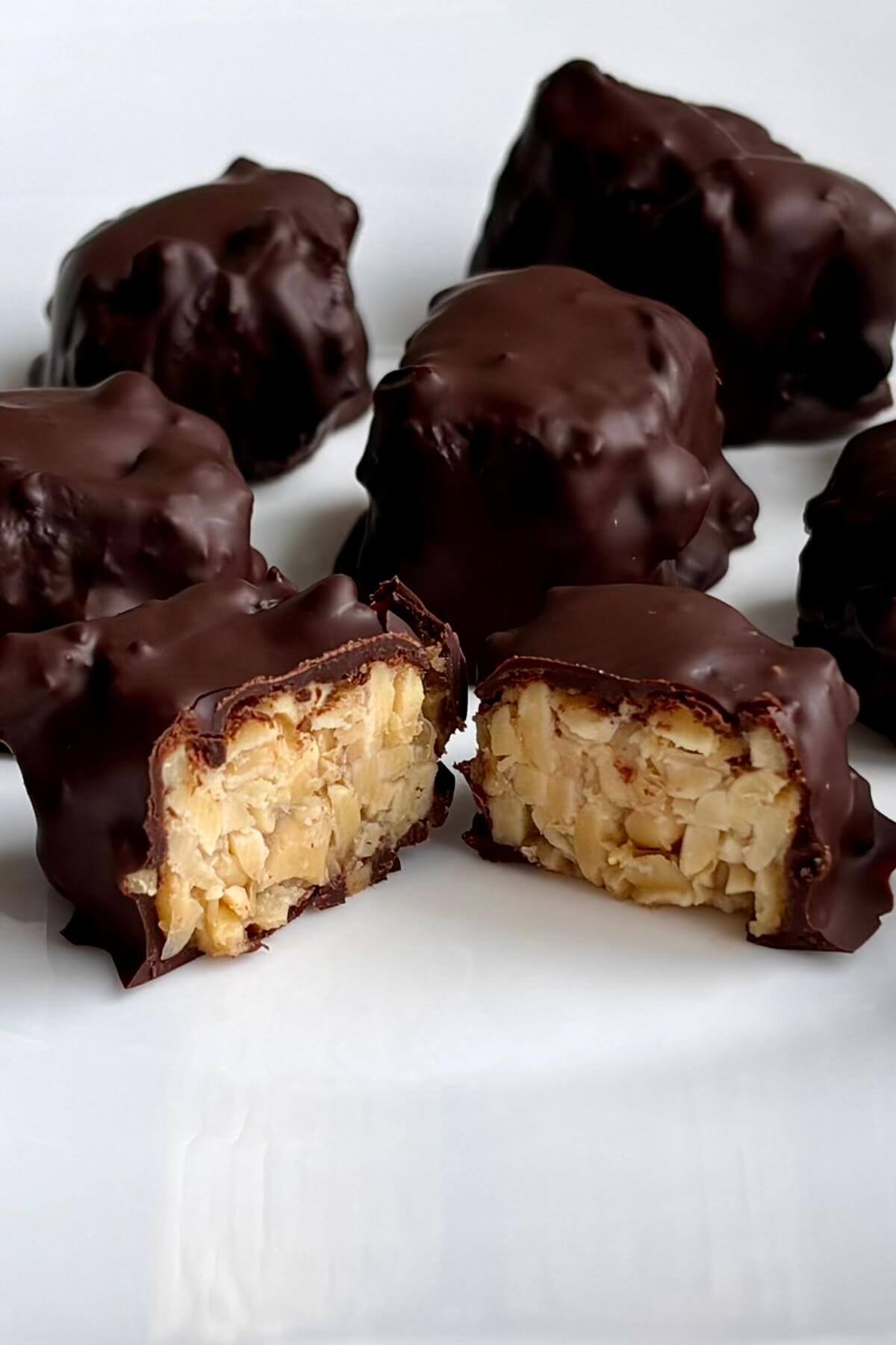 Chocolate coated tempeh treats on a plate.