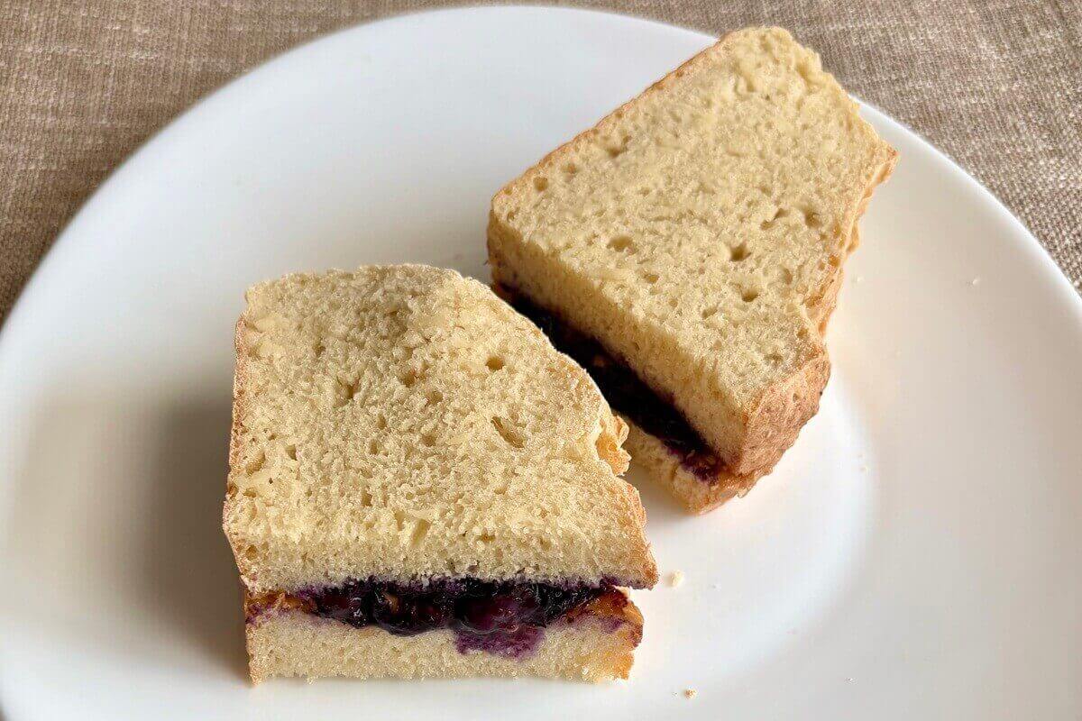A peanut butter and jam sandwich on bread made with tofu.
