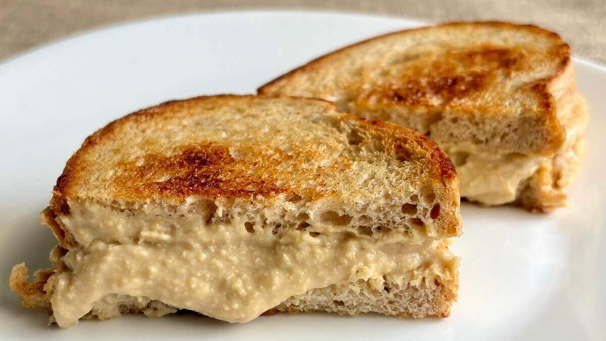 A vegan grilled cheese sandwich on a plate.
