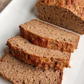 Banana bread with no sugar added on a white plate.