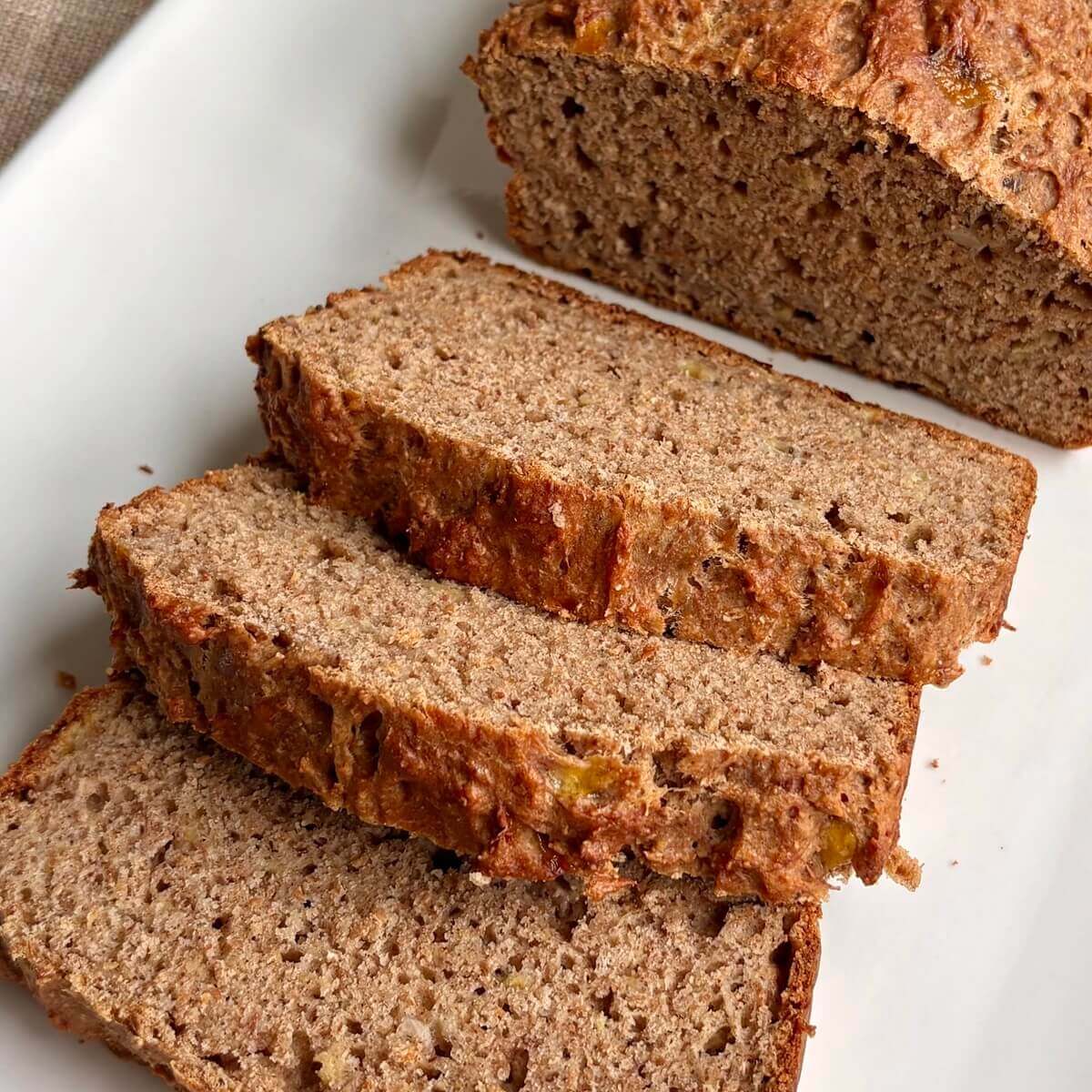Banana bread with no sugar added on a white plate.