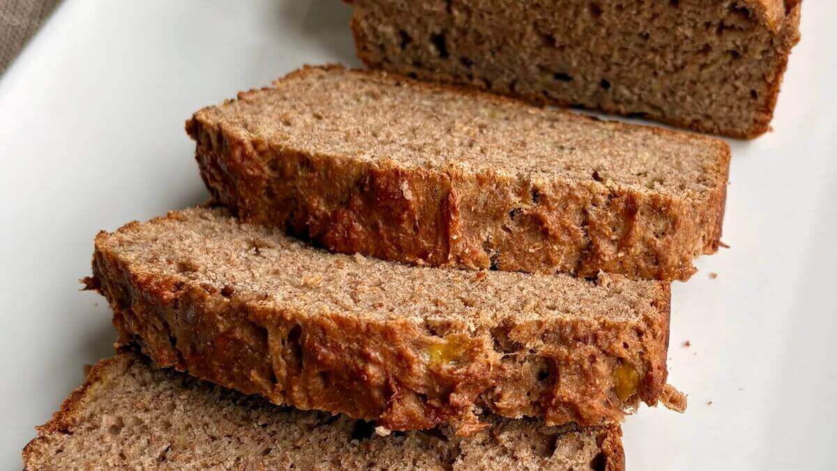 Slices of banana bread without sugar on a white plate.