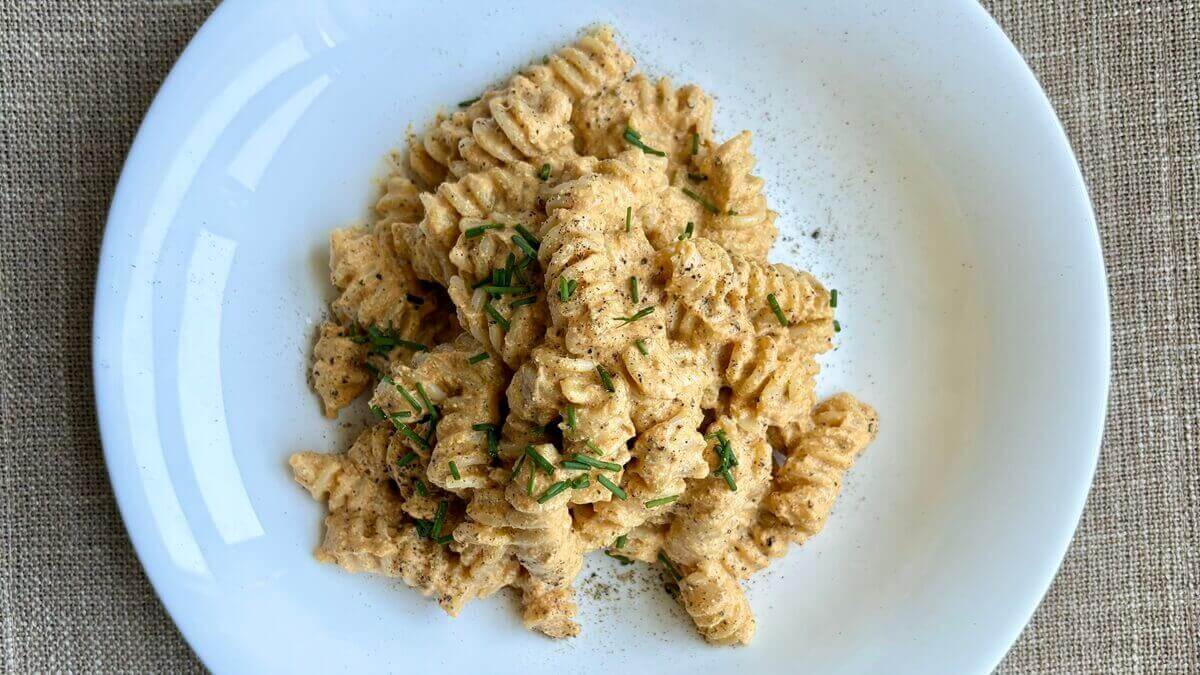 Fusilli pasta smothered in a pumpkin puree pasta sauce.