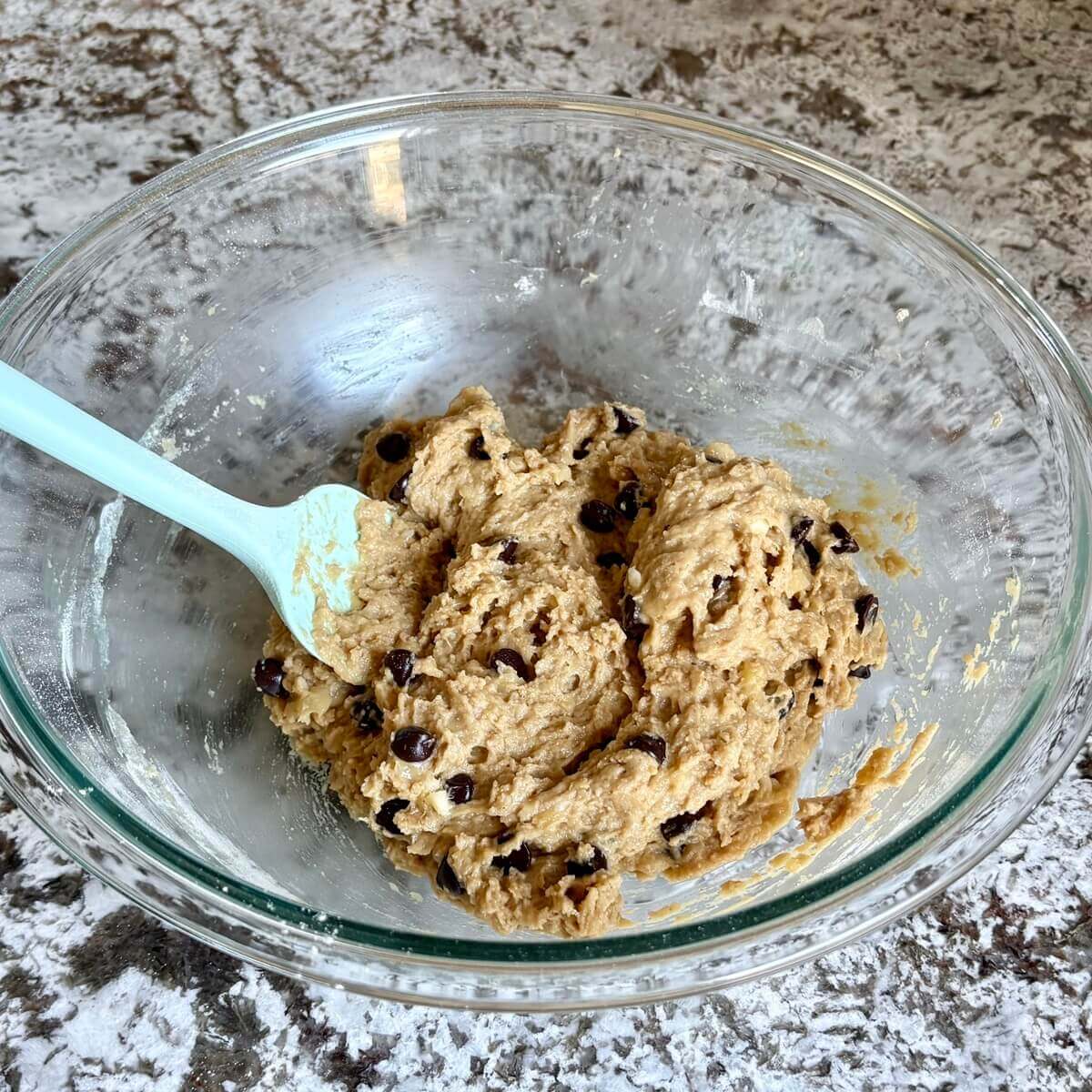 Seitan-based batter for banana bread in a mixing bowl.